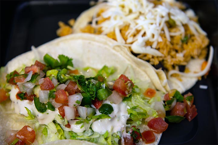 We are a Taqueria because our most requested dishes are Tacos, especially mixed seafood and meat taco orders.